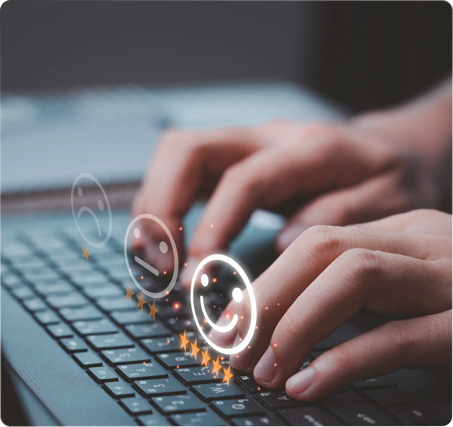 Typing on keyboard with floating smiley faces.